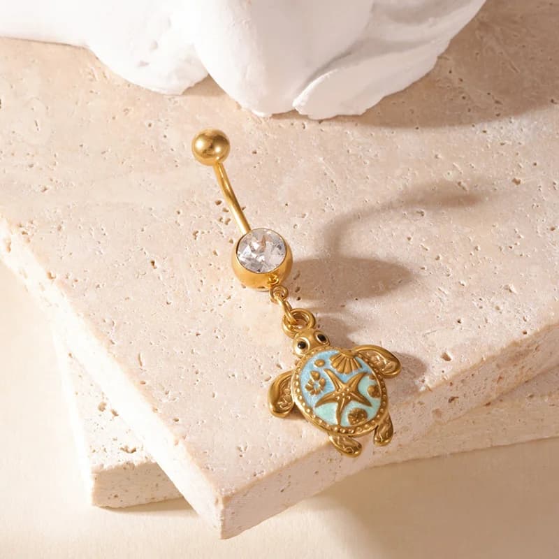 Piercing do pupku s visutým žirafou a zirkónmi